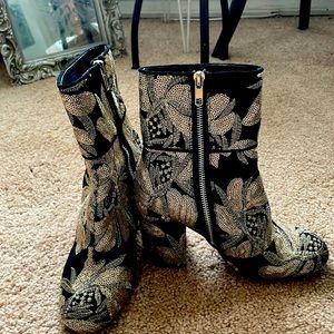 Metallic floral embossed boot with a gold design